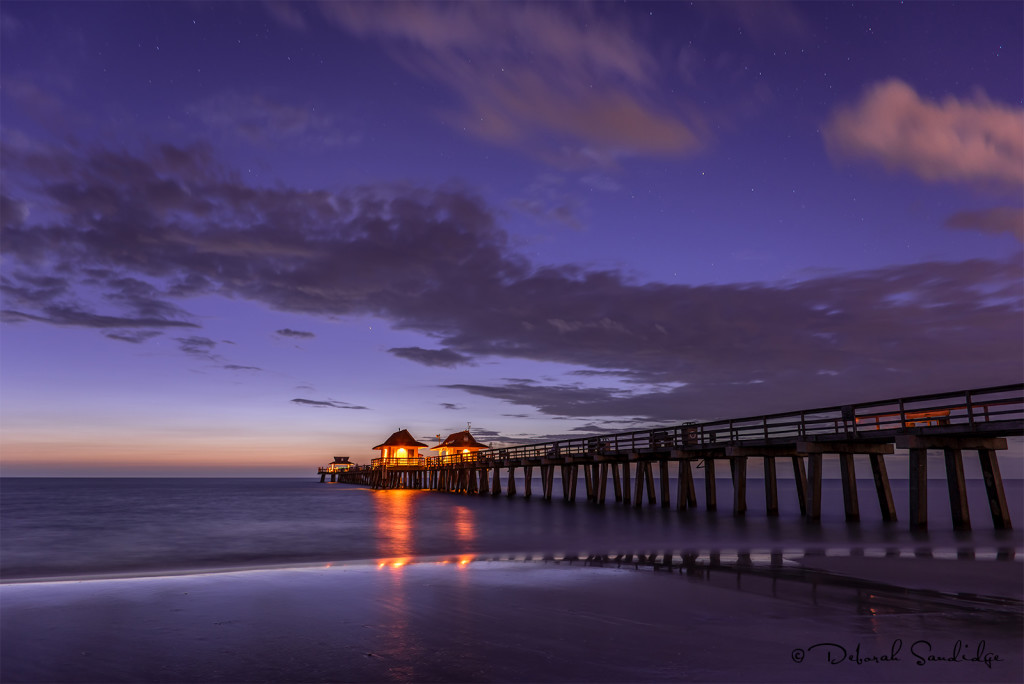 Naples fishing pier on a starry night.